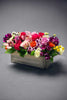 Mixed assorted cheery seasonal arrangement designed in a long wooden box