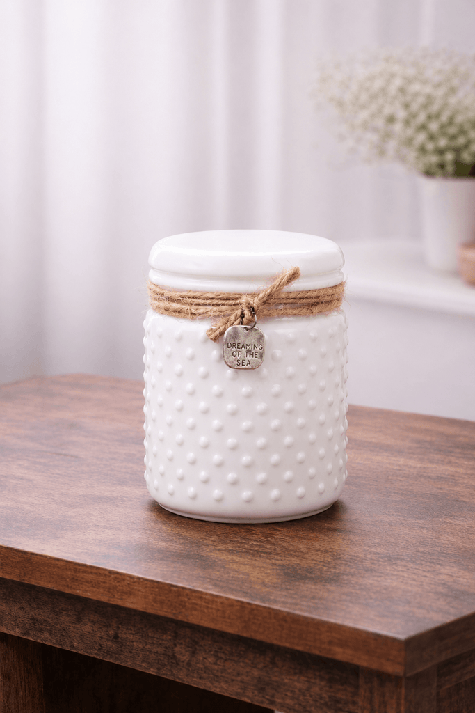 Image of luxury white candle on a wooden table