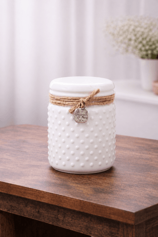Image of luxury white candle on a wooden table