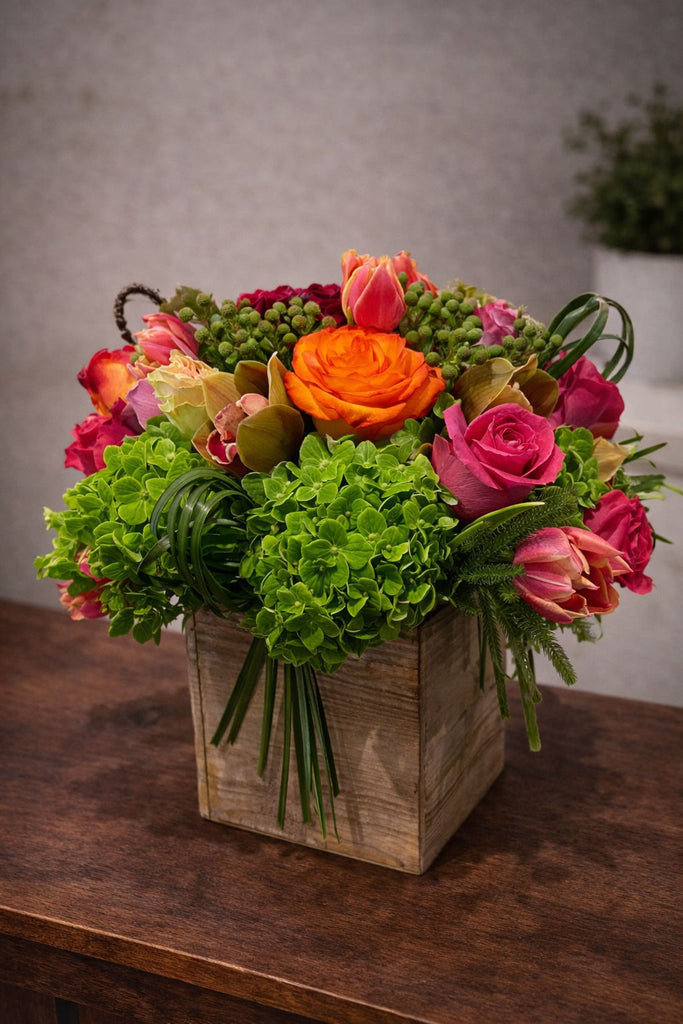 Wooden Charm floral arrangement in a rustic wooden box with green hydrangea, roses, tulips, cymbidium orchids, berry accents, and seasonal blooms.